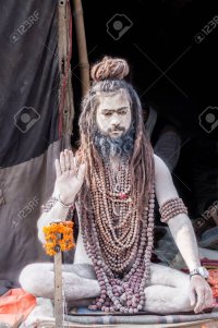 65531181-allahabad-india-feb-13th-a-young-naga-baba-sits-in-his-tent-at-the-kumbha-mela-on-feb...jpg